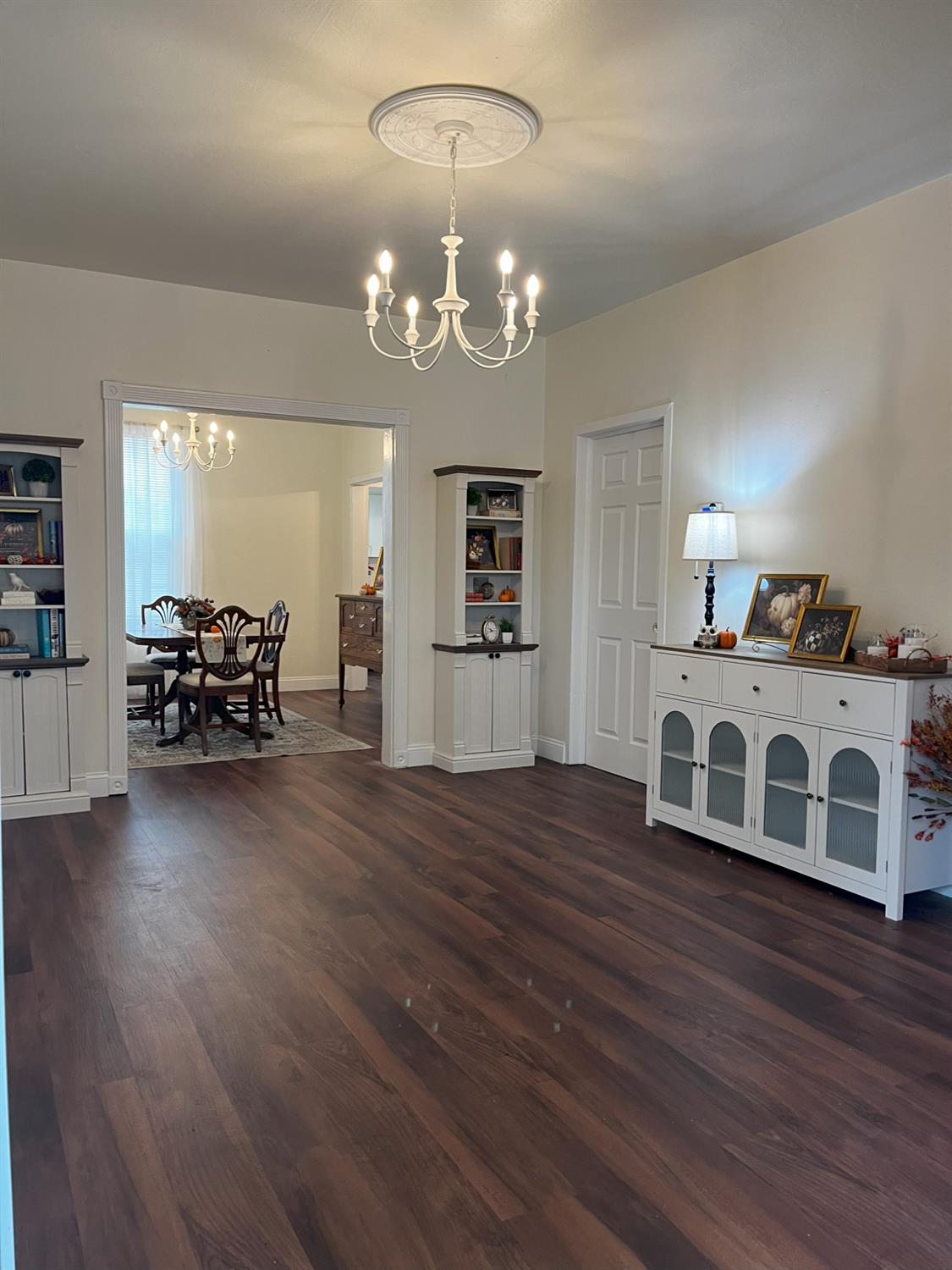 1659 Hazel Street Gridley, CA 95948 - Photo 6 of 70 a large white kitchen with a chandelier