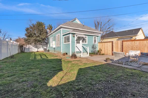 a view of a livingroom with furniture and hardwood floor