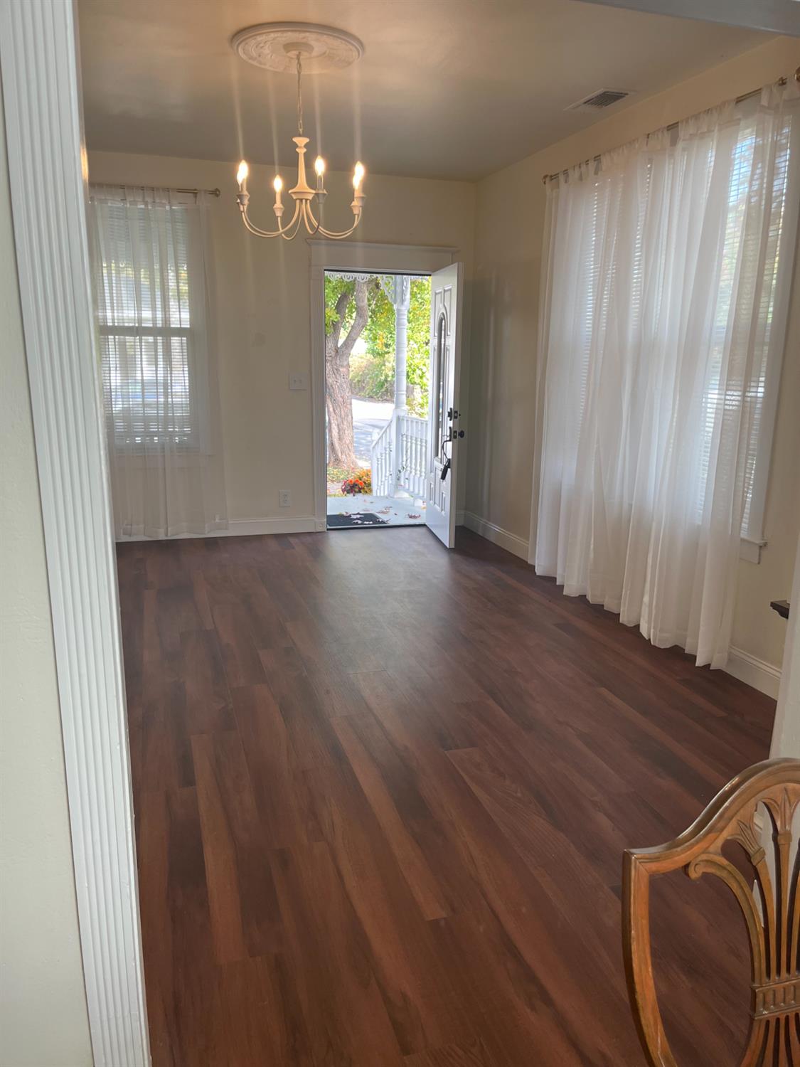 1659 Hazel Street Gridley, CA 95948 - Photo 8 of 70 an empty room with wooden floor and windows