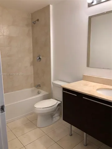 a bathroom with a sink a toilet and a bathtub