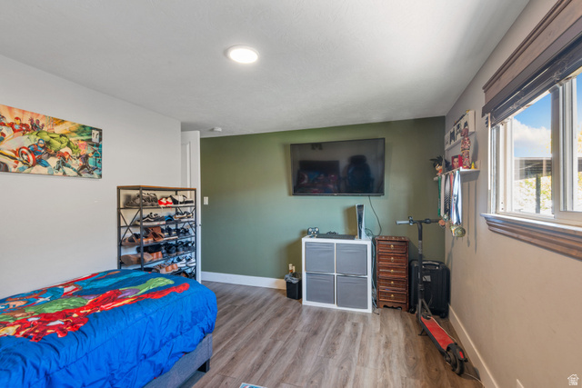 255 North 1600 West, Unit 60 Provo, UT 84601 - Photo 13 of 22 Bedroom with wood finished floors and baseboards
