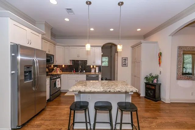 a bedroom with a bed and a table in it