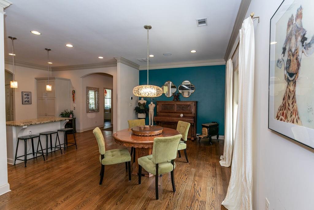 1084 Sanders Avenue Southeast, Unit AB Atlanta, GA 30316 - Photo 22 of 76 a view of a dining room with furniture and wooden floor