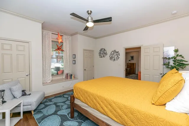 a bedroom with a bed and a window