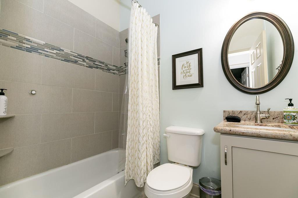 1084 Sanders Avenue Southeast, Unit AB Atlanta, GA 30316 - Photo 32 of 76 a bathroom with a toilet a sink and a bathtub