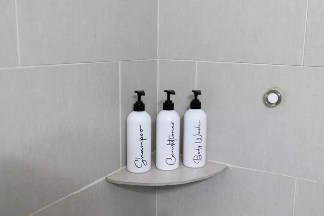 a balcony with wooden floor table and chairs