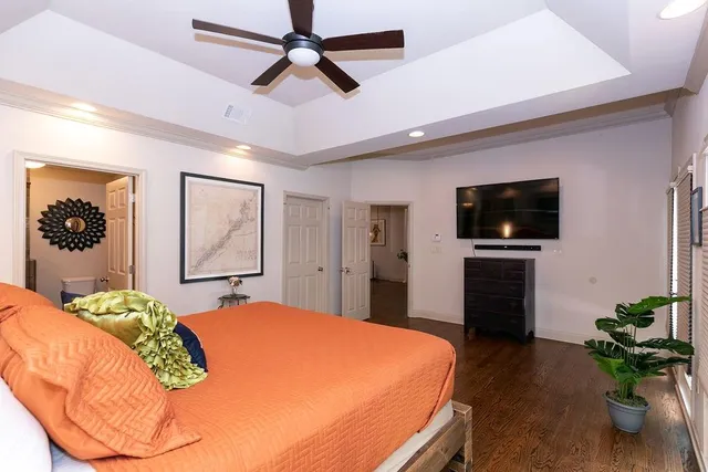 a bedroom with a bed and a walk in closet