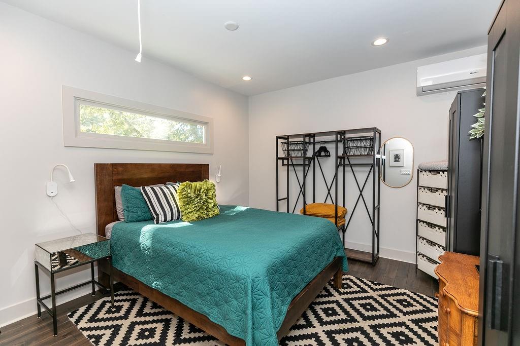 1084 Sanders Avenue Southeast, Unit AB Atlanta, GA 30316 - Photo 65 of 76 a bedroom with a bed and a table