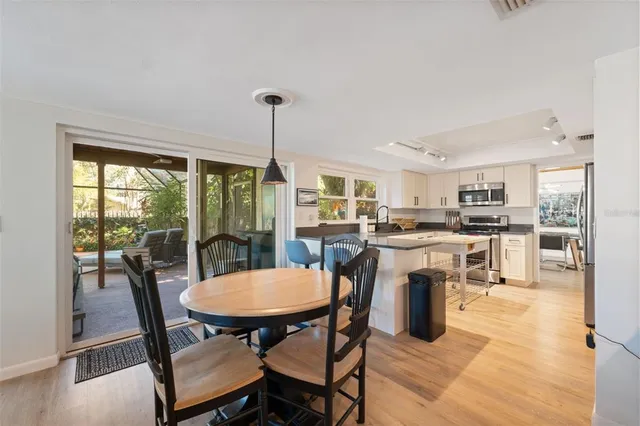 a living room with furniture a window and gym equipment