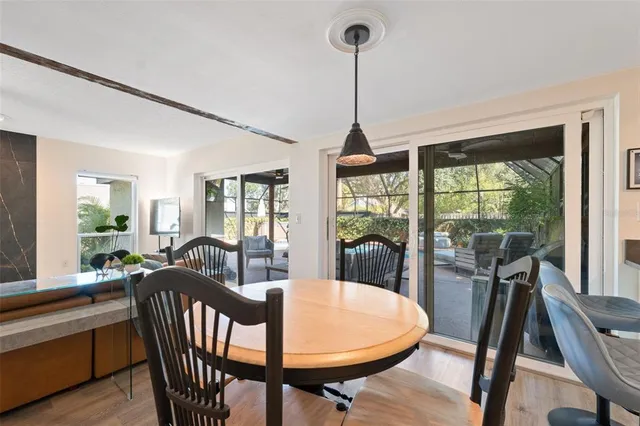 a bedroom with furniture and a large window