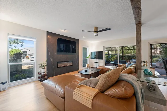 a bathroom with a granite countertop sink a toilet and a mirror