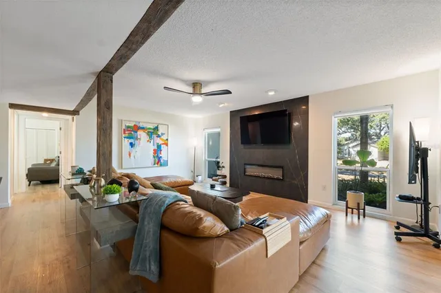 a bathroom with a granite countertop sink a toilet and a mirror