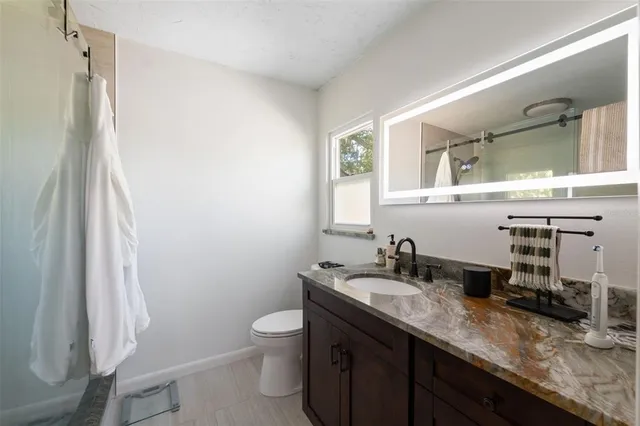 a view of a backyard with sitting area