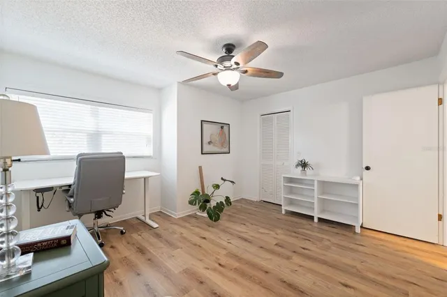 a view of a house with a yard covered with snow