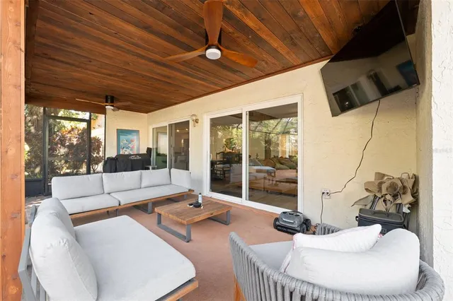 a view of a house with a tree and plants