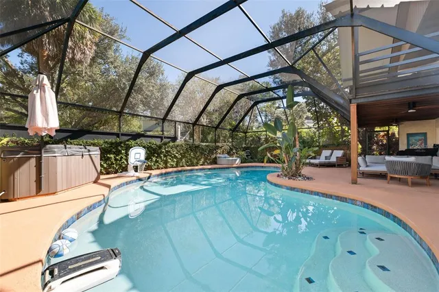 an aerial view of a house with a yard and garden