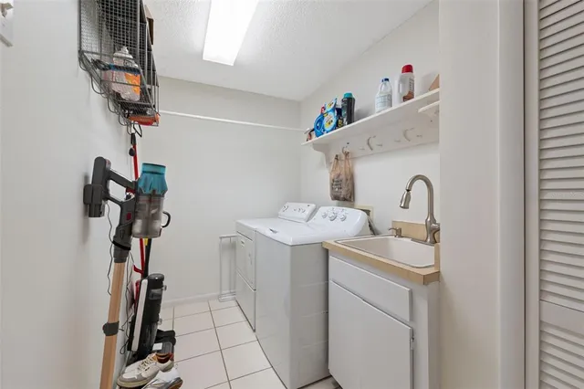 an aerial view of residential houses with outdoor space and lake view