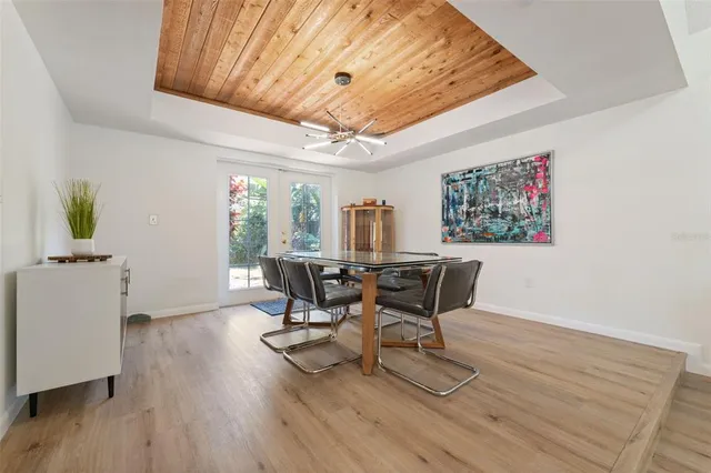 a kitchen with stainless steel appliances granite countertop a stove a sink and a granite counter tops with white cabinets