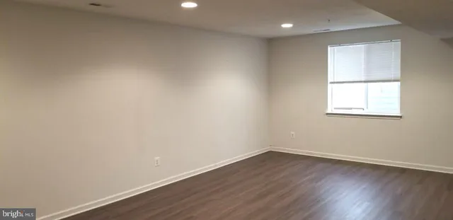 a bathroom with a sink a toilet and shower curtain
