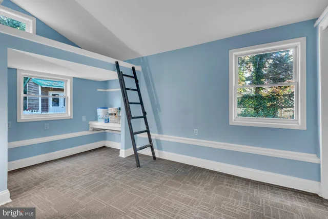 a kitchen with stainless steel appliances a stove a microwave and cabinets