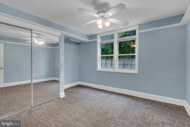 a kitchen with stainless steel appliances granite countertop a refrigerator a stove and a wooden floors