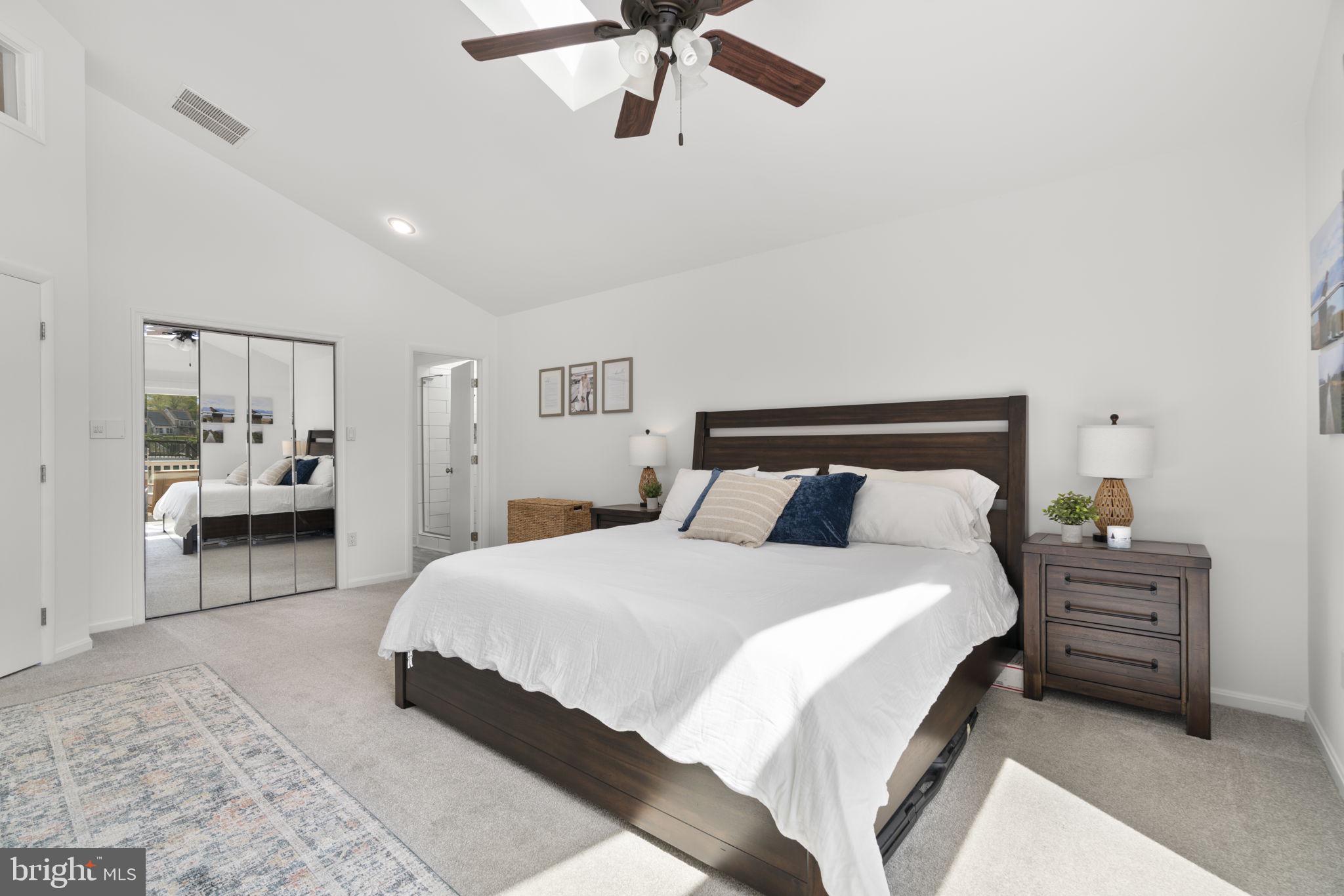 25 Leeland Road Edgewater, MD 21037 - Photo 14 of 48 a bedroom with a bed and a chandelier