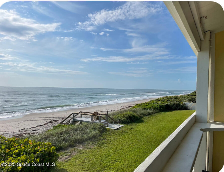 2953 South Hwy A1A, Unit 7B Melbourne Beach, FL 32951 - Photo 1 of 22 a view of a yard with an outdoor seating