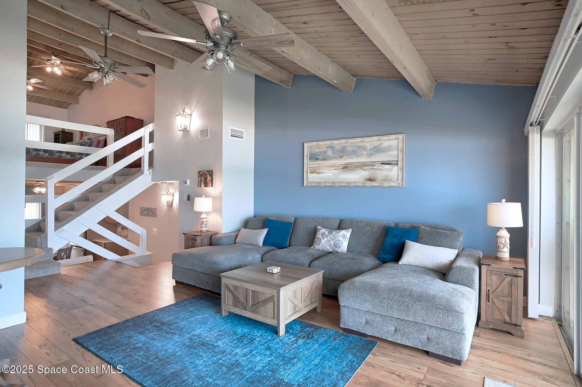 2953 South Hwy A1A, Unit 7B Melbourne Beach, FL 32951 - Photo 11 of 22 a living room with furniture and a ceiling fan