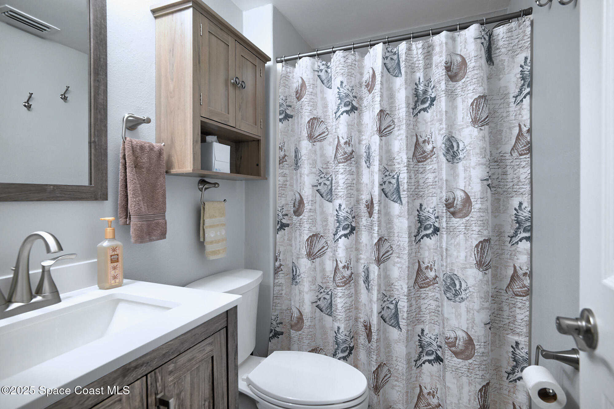 2953 South Hwy A1A, Unit 7B Melbourne Beach, FL 32951 - Photo 16 of 22 a bathroom with a sink and toilet