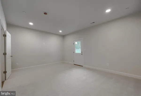 an empty room with a empty space and a window