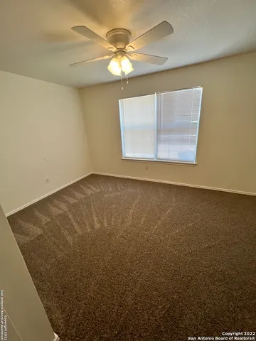 an entryway door with a hallway in the back