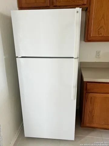 a stove top oven sitting inside of a kitchen