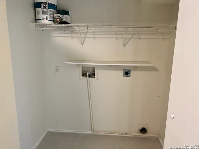 a view of a hallway with washer and dryer