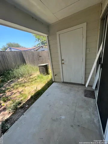 a view of city street with a parked cars
