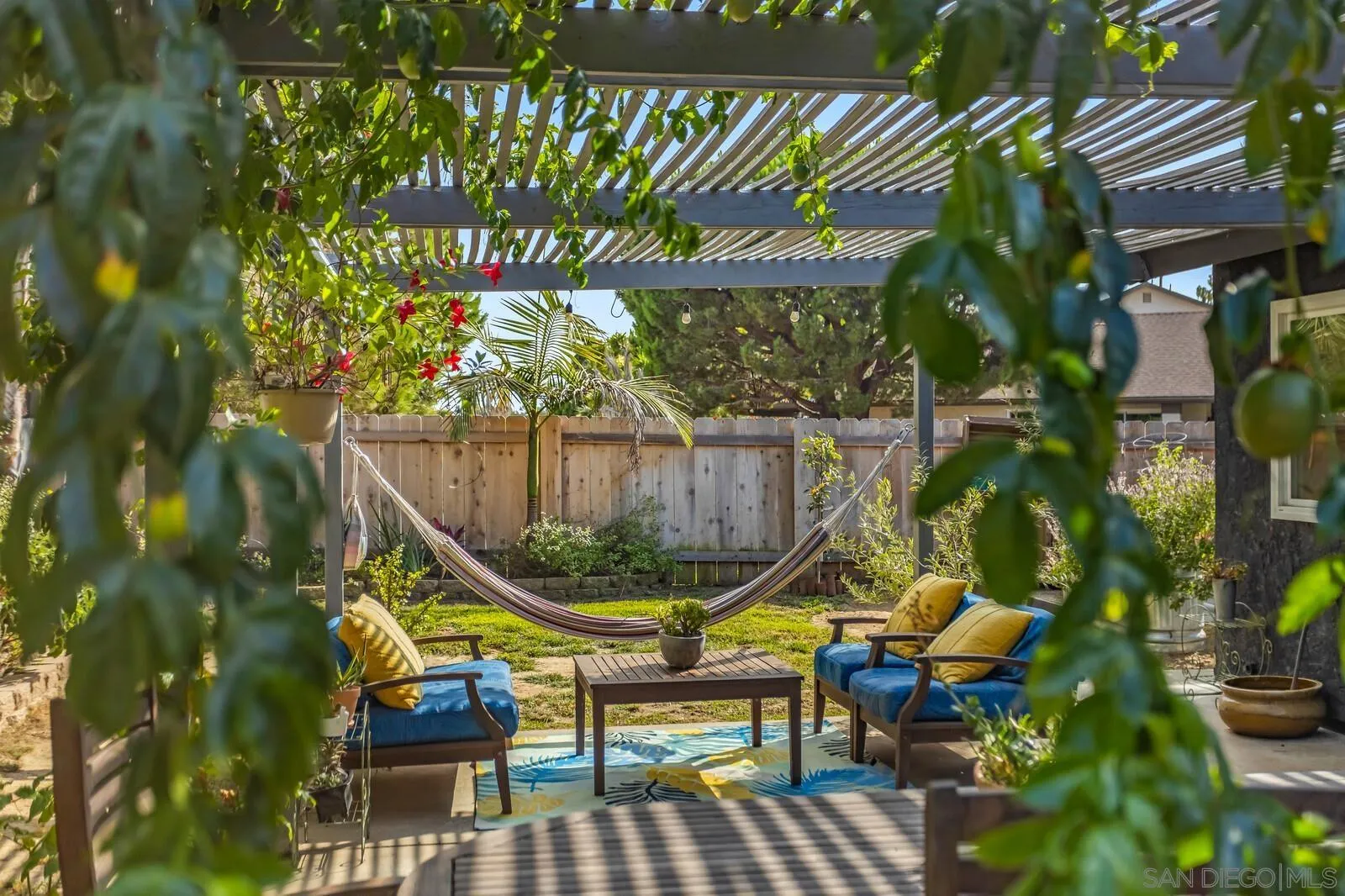 398 Compass Road Oceanside, CA 92054 - Photo 29 of 42 a view of a chairs and table in a patio