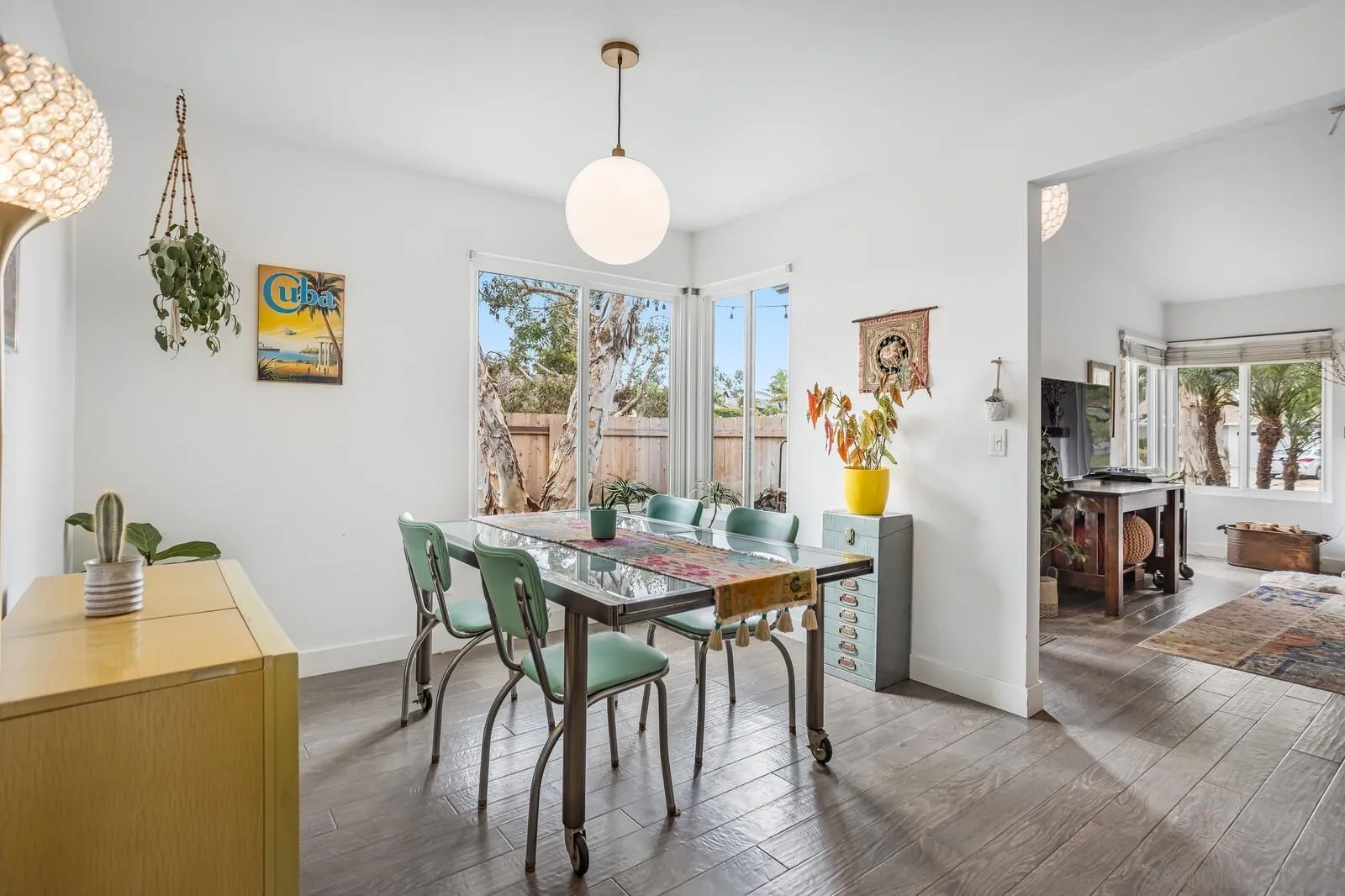 398 Compass Road Oceanside, CA 92054 - Photo 10 of 42 a view of a dining room with furniture and a chandelier