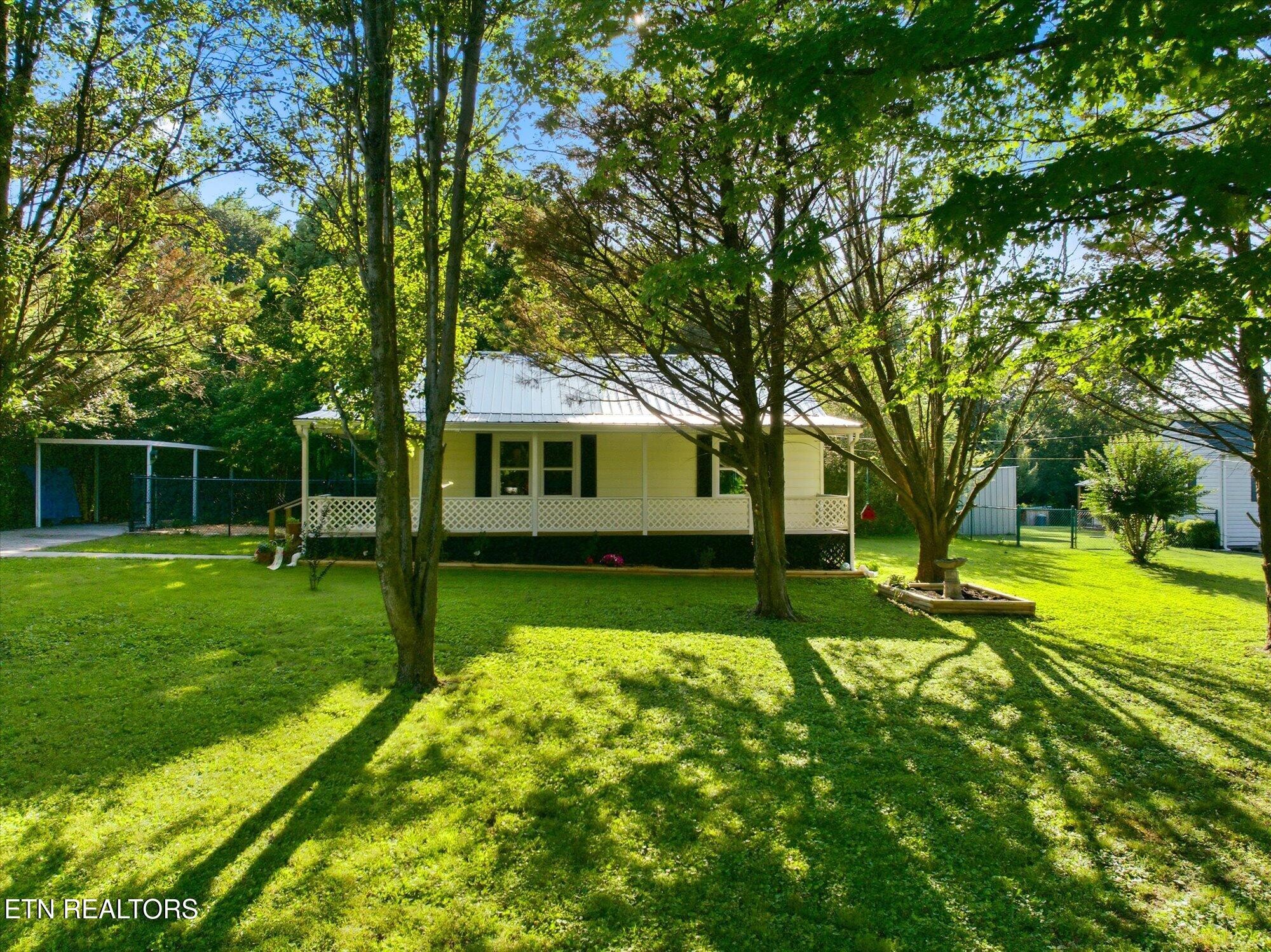 a view of a house with a back yard