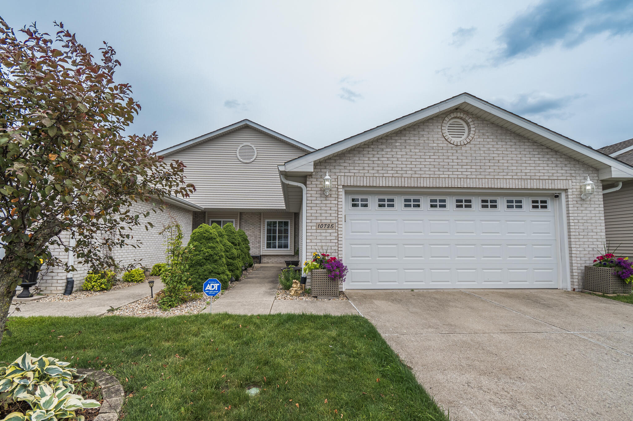 10735 Keystone Lane Crown Point, IN 46307 - Photo 1 of 23 a front view of a house with a yard and garage