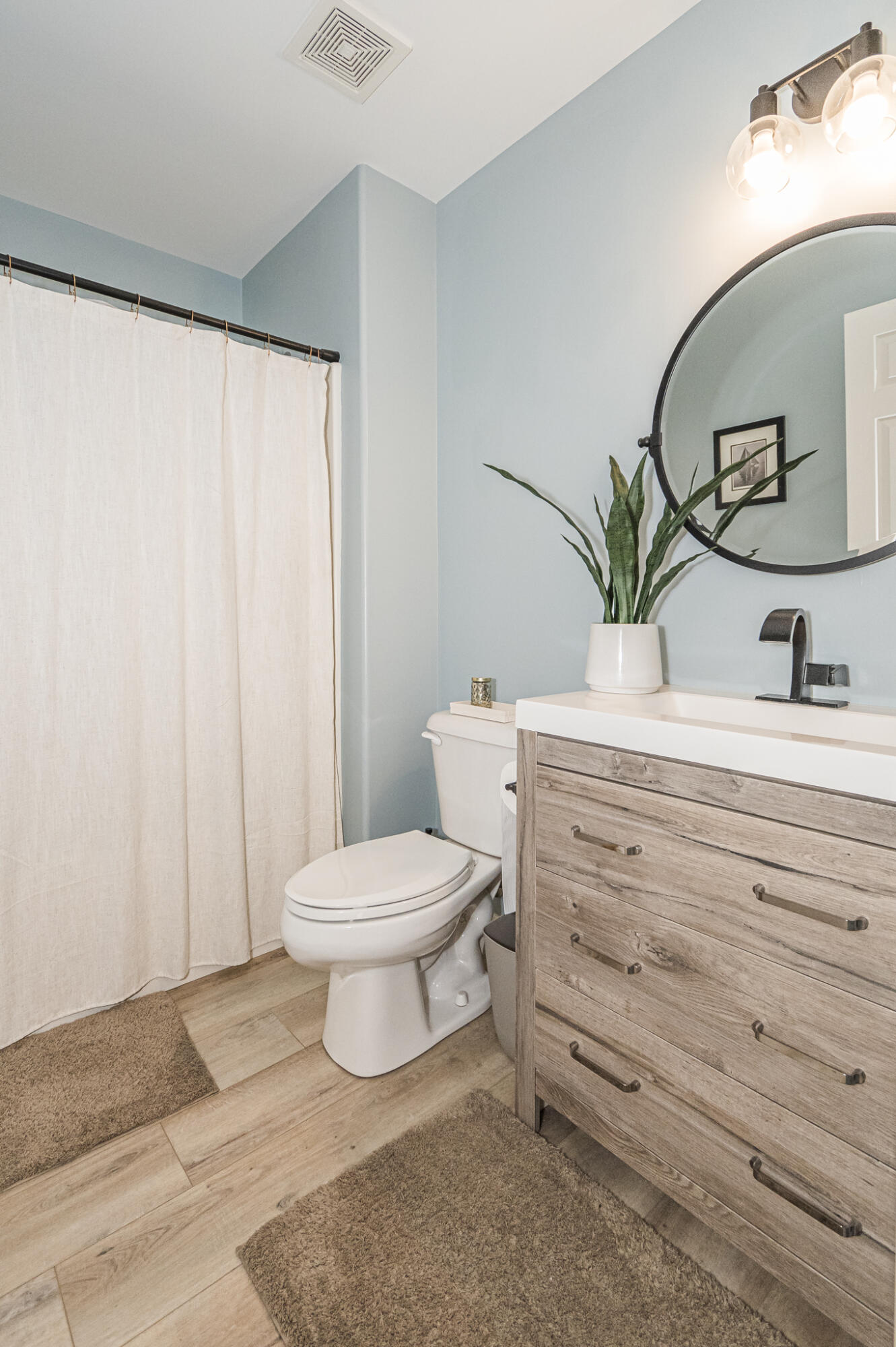 10735 Keystone Lane Crown Point, IN 46307 - Photo 17 of 23 a bathroom with a toilet a sink and mirror