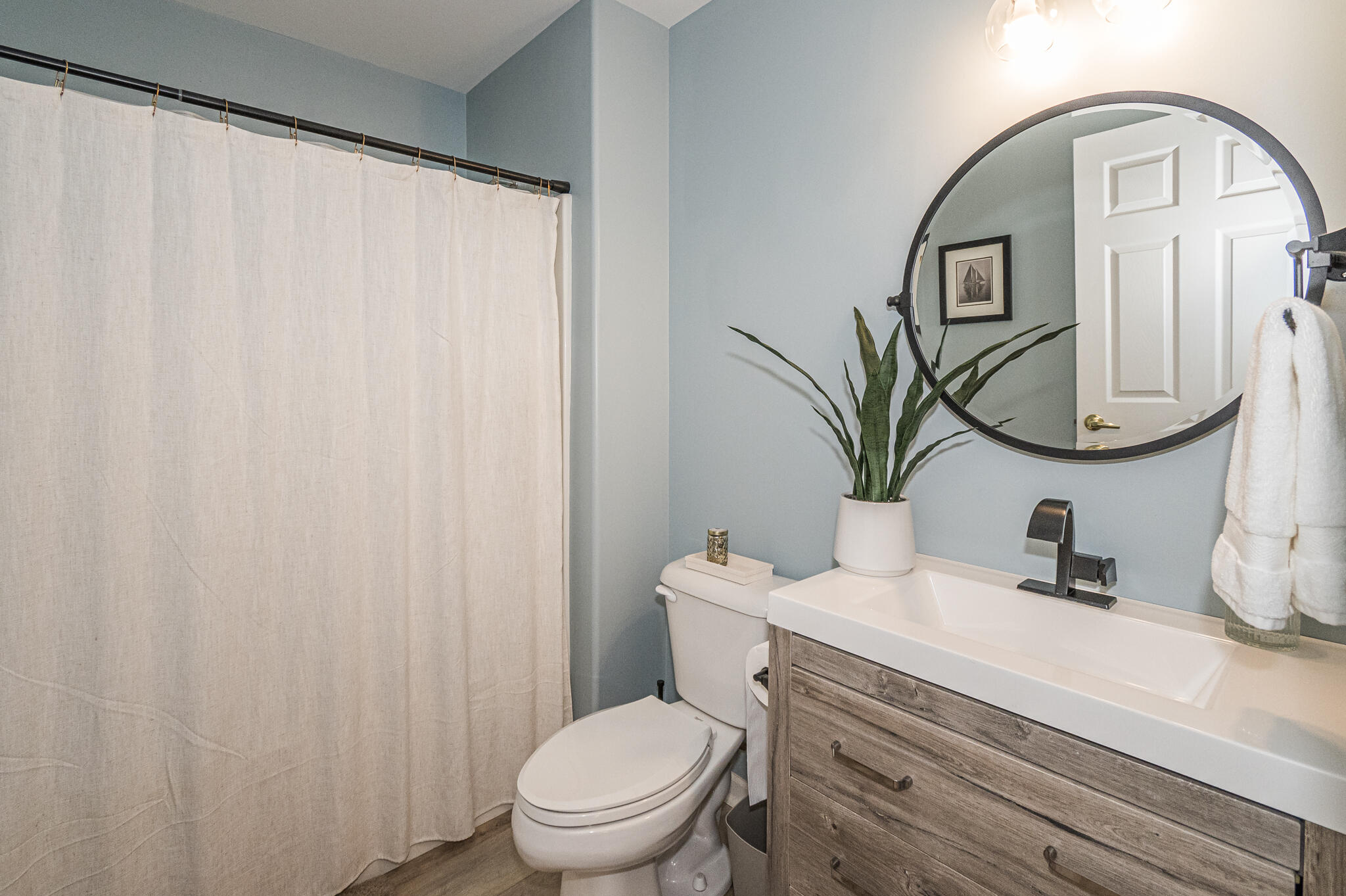 10735 Keystone Lane Crown Point, IN 46307 - Photo 18 of 23 a bathroom with a toilet a sink and a mirror