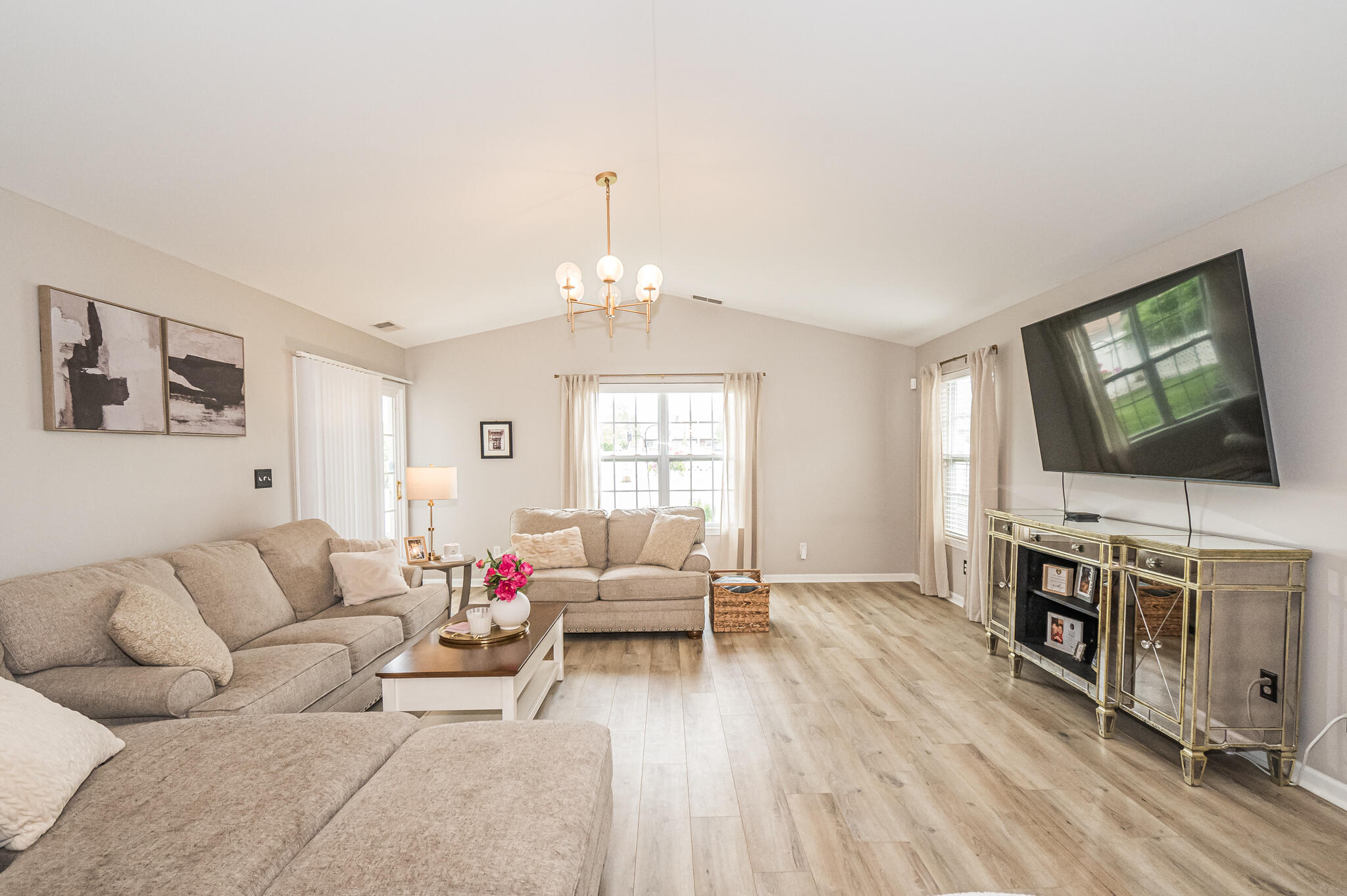 10735 Keystone Lane Crown Point, IN 46307 - Photo 10 of 23 a living room with furniture and a flat screen tv