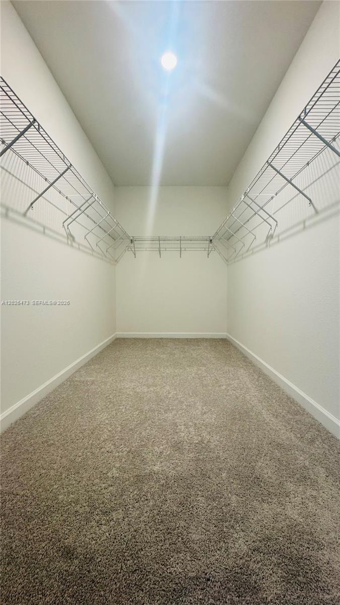 19479 Southwest 340th Street, Unit 1 Homestead, FL 33034 - Photo 23 of 58 a view of a room with an empty space