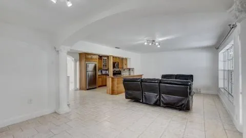 a view of workspace with furniture and window