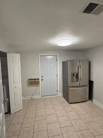 a living room with a couch and a stove top oven