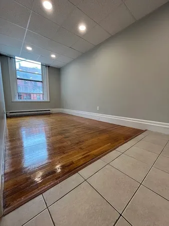 an empty room with wooden floor