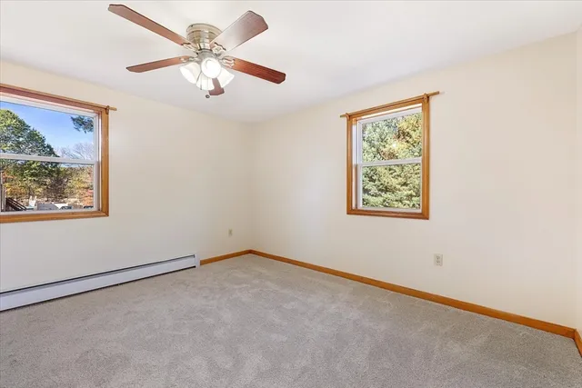 a view of room with window and ceiling fan