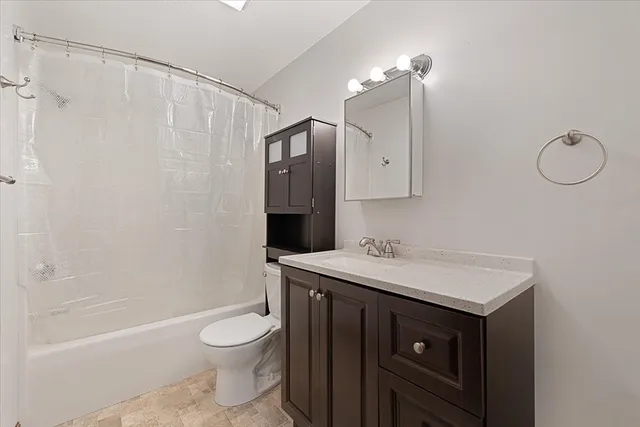 a view of a room with wooden walls