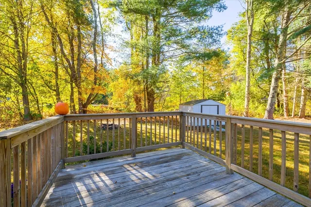 a view of wooden balcony with furniture