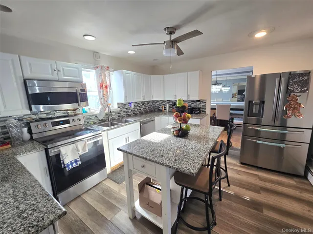 $599,000 | 70 Breston Drive East, Shirley, NY 11967