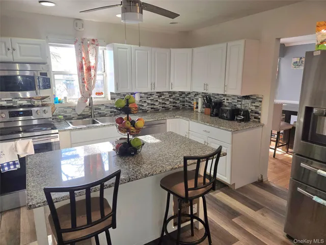 $599,000 | 70 Breston Drive East, Shirley, NY 11967